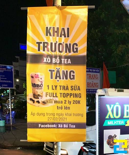 In băng rôn khai trương